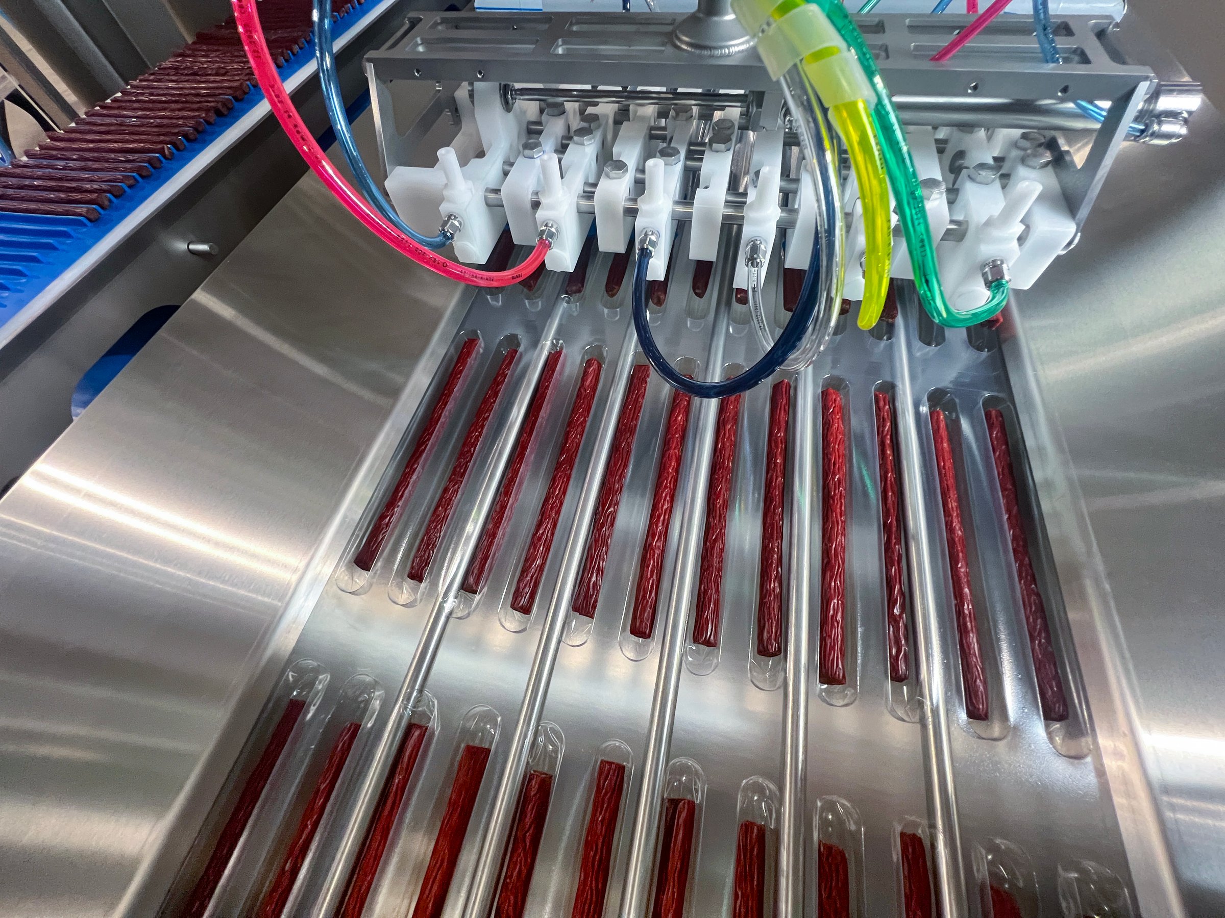 Kestrel robot collating snack sticks into a case